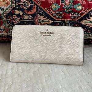 Kate Spade Dumpling Large Slim Bifold Wallet 
COLOR: Parchment
